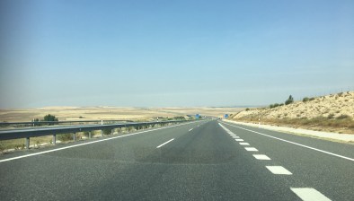 Barren lands, empty roads heading towards Portugal